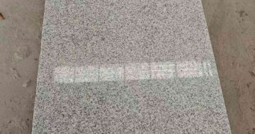 金华芝麻白光面毛板