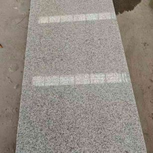 金华芝麻白光面毛板